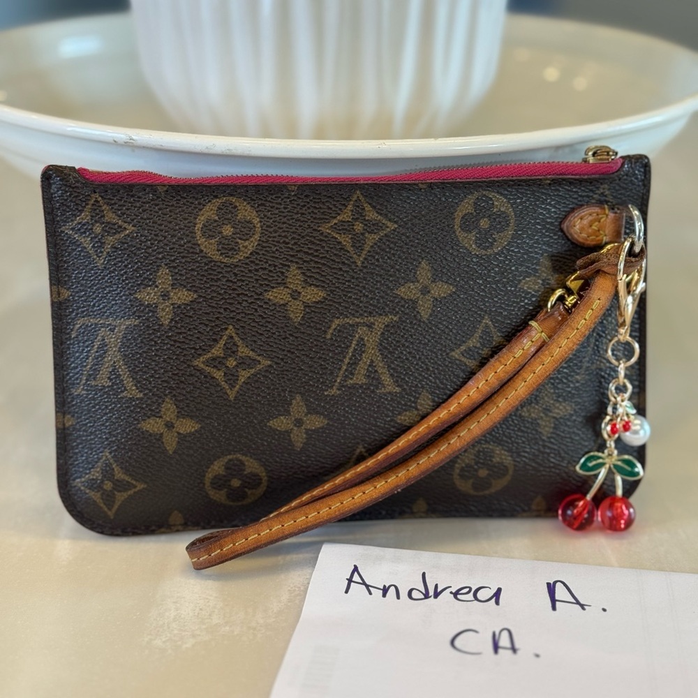 Louis Vuitton Brown Clutch with Iconic Monogram and Gold Zipper